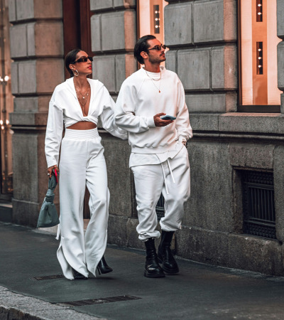 a man and a woman walking down the street