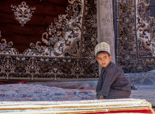 a group of people wearing white robes and holding instruments