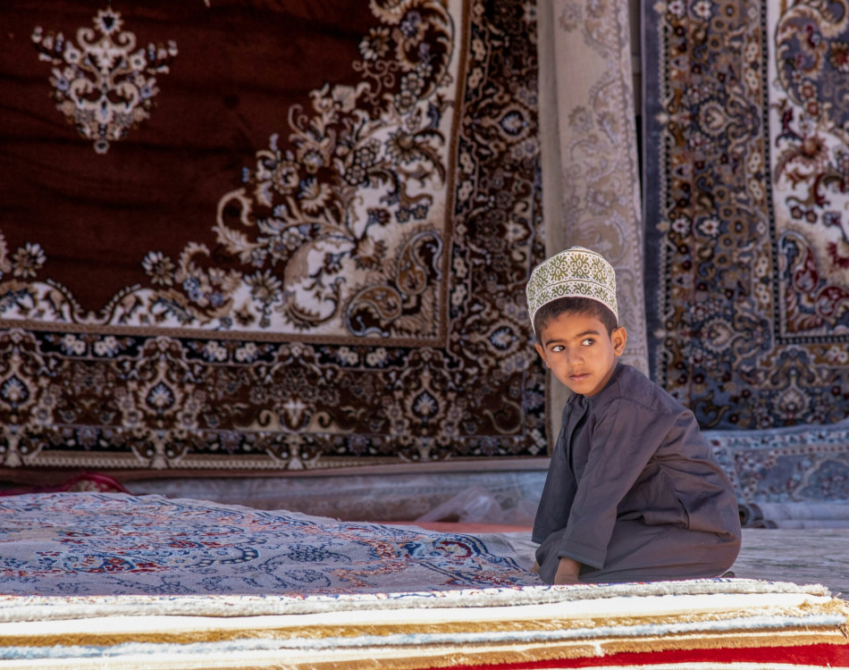 a group of people wearing white robes and holding instruments