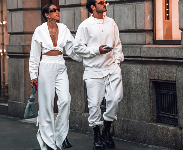 a man and a woman walking down the street