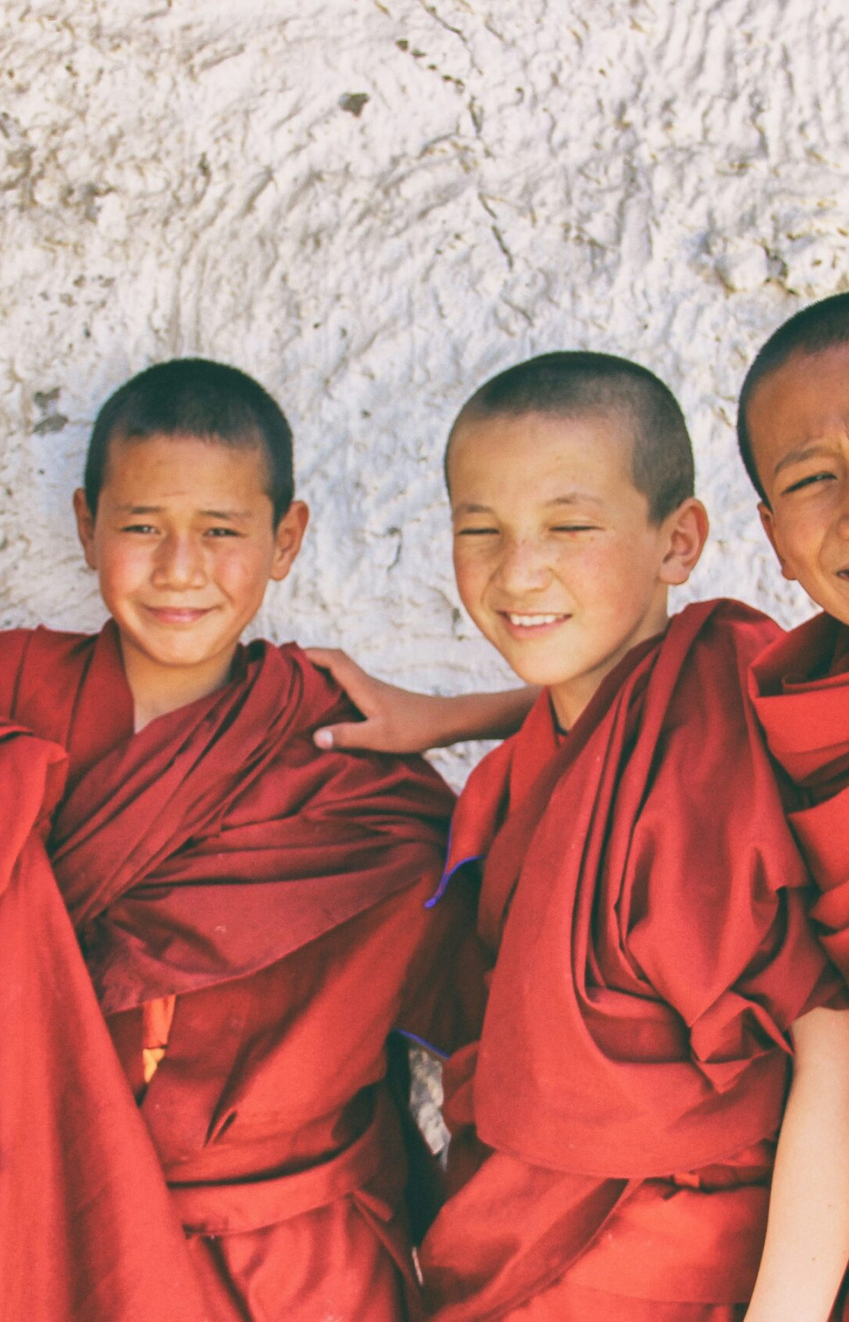 3 men in red robe