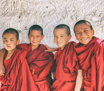3 men in red robe