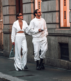 a man and a woman walking down the street