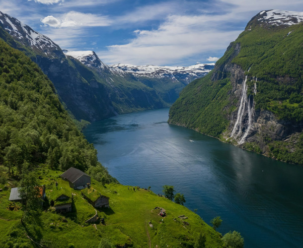 A river running through a valley between mountains in Norway