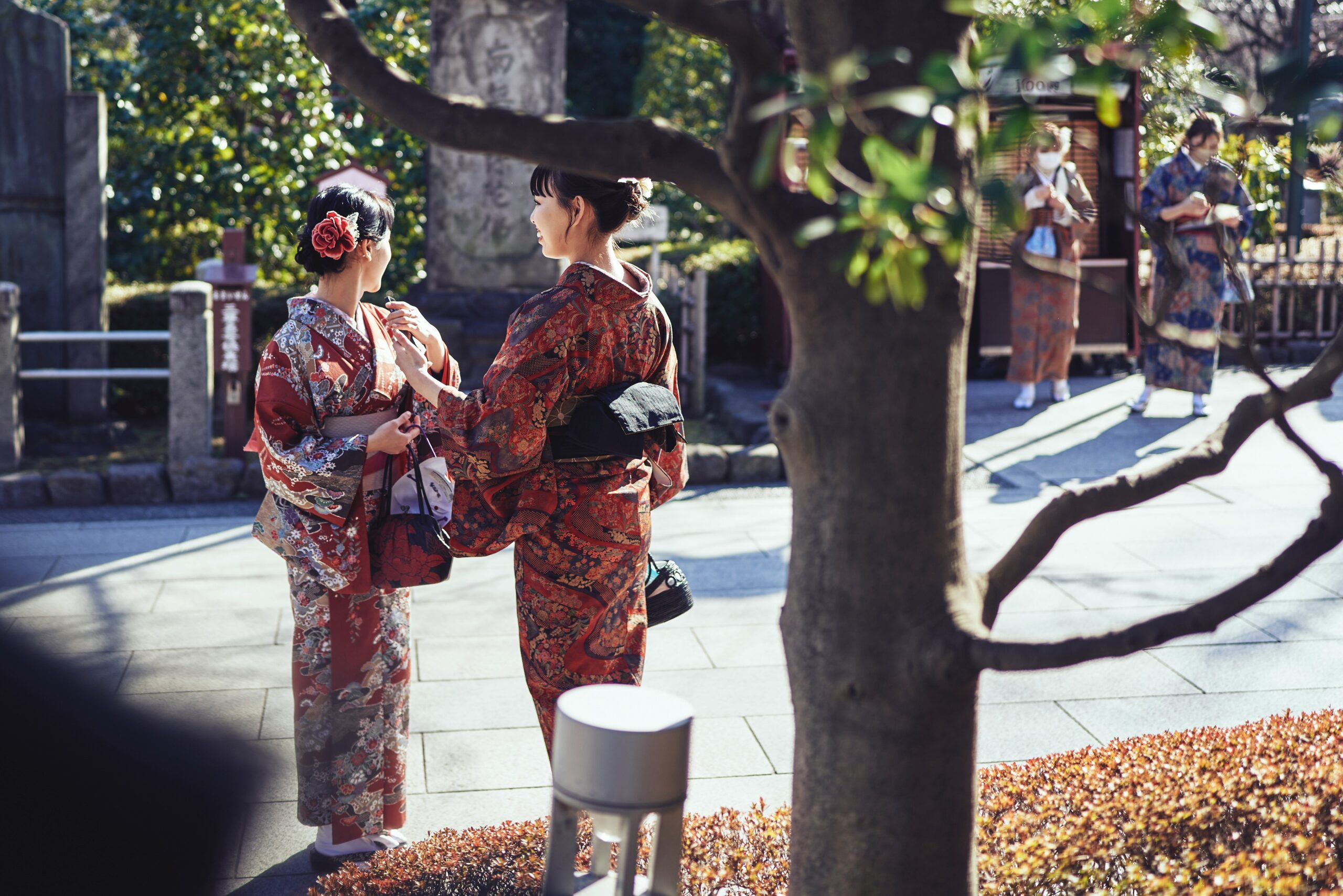 Emotiona expression across cultures. Japanese women standing next to each other