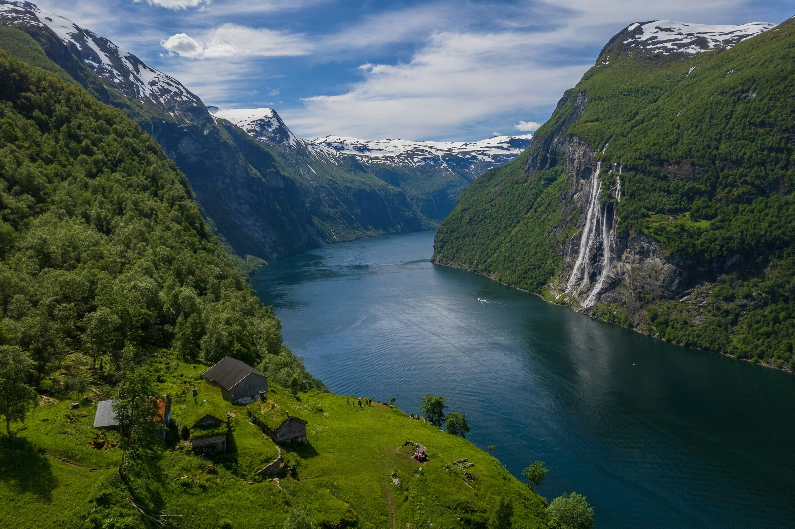 A river running through a valley between mountains in Norway