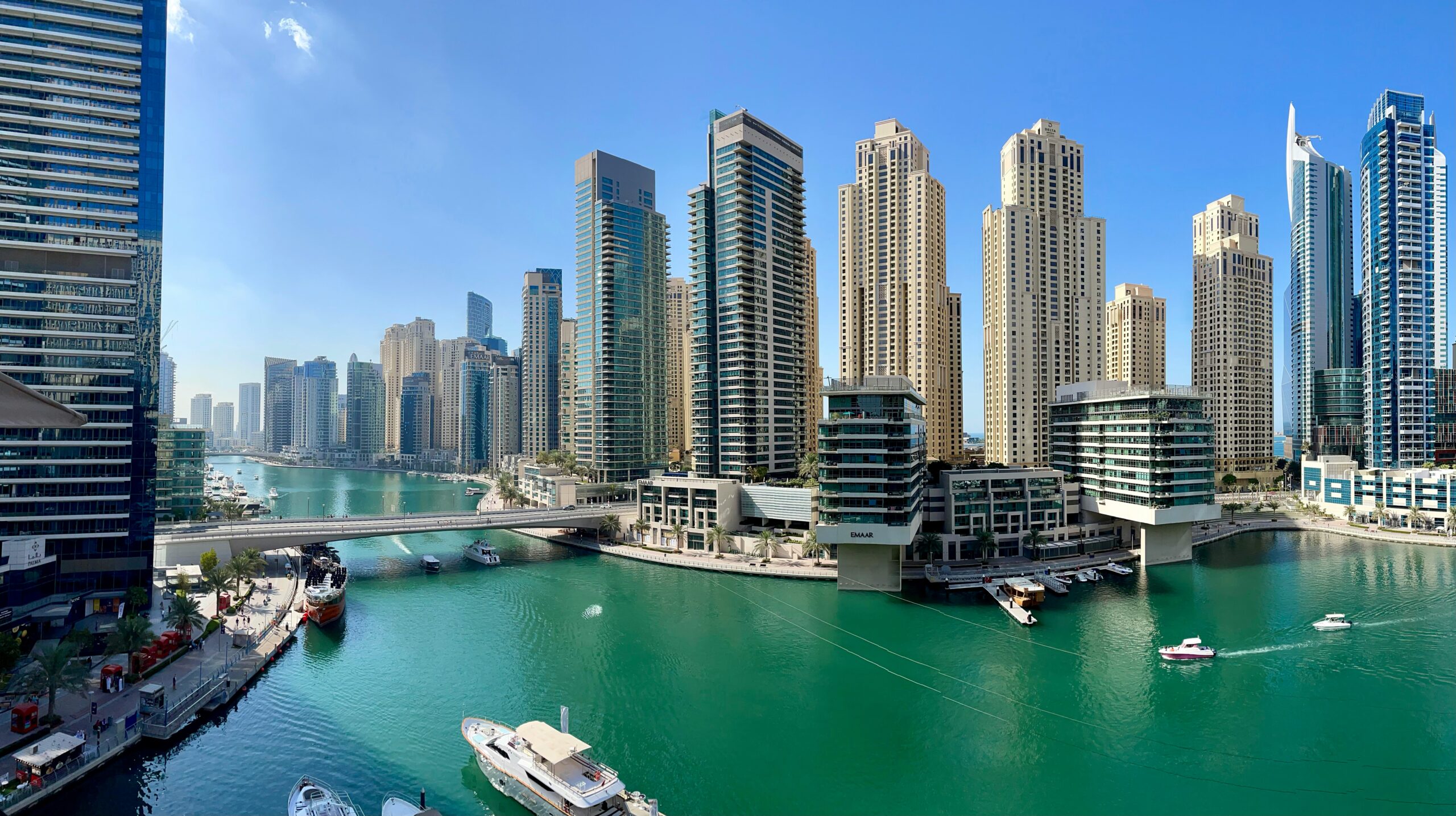 Dubai high rise buildings near body of water during daytime