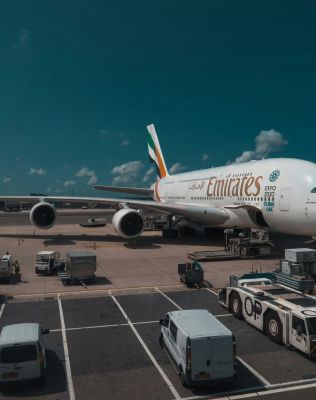white and red passenger plane in the sky