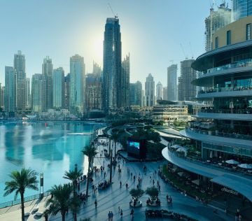 people walking on the street near high rise buildings during daytime