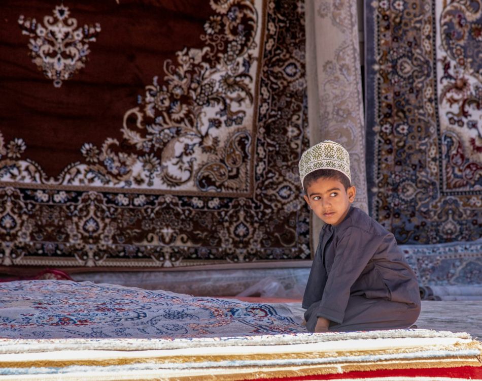 a group of people wearing white robes and holding instruments
