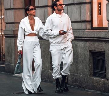 a man and a woman walking down the street