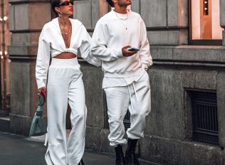 a man and a woman walking down the street