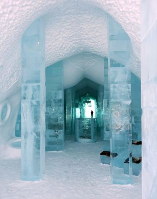 a snow covered street with houses and trees