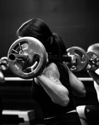 woman doing yoga near rock during daytime