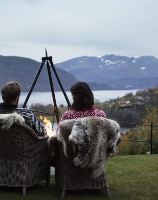 brown wooden bench on dock near lake during daytime