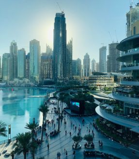 people walking on the street near high rise buildings during daytime